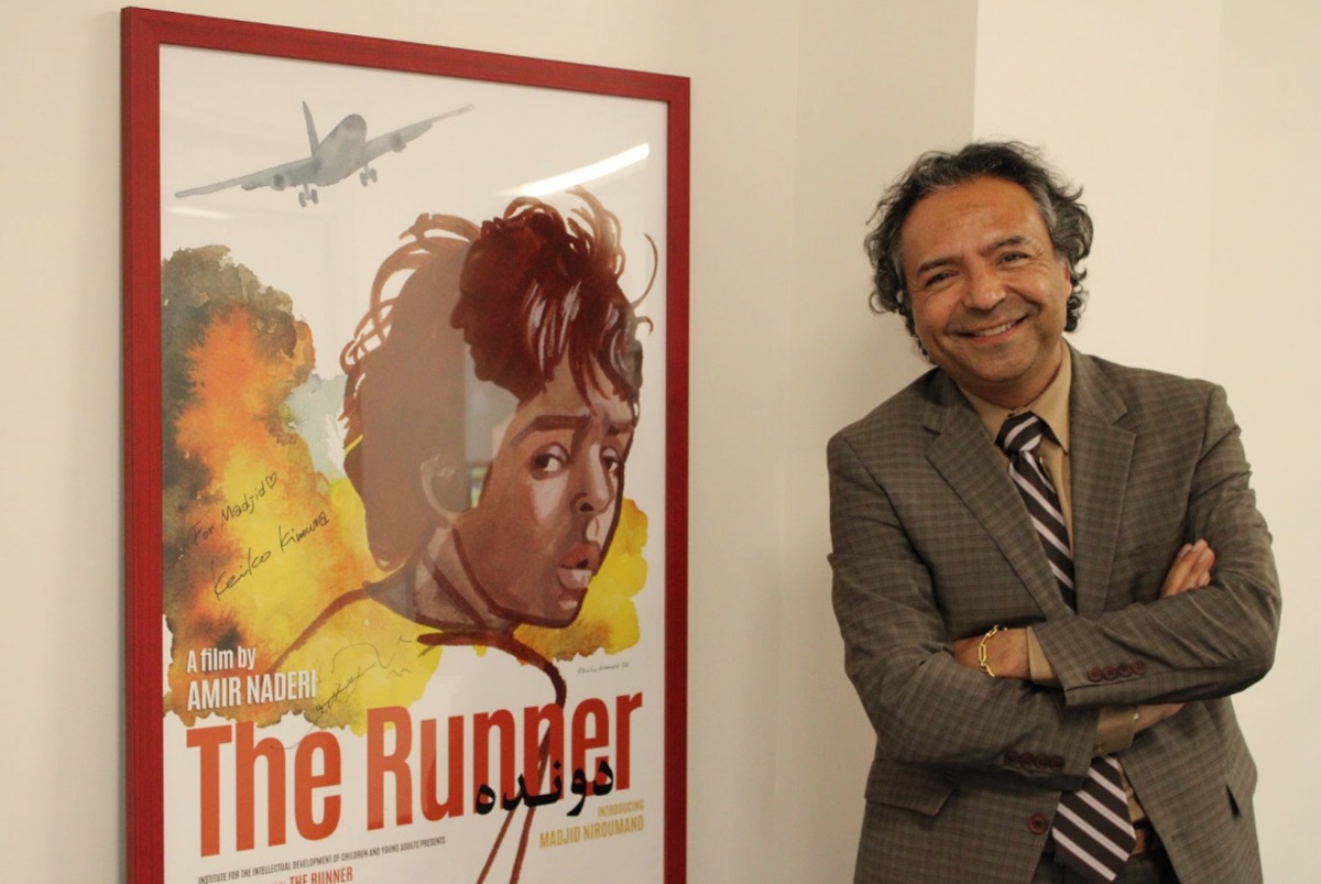Niroumand with poster